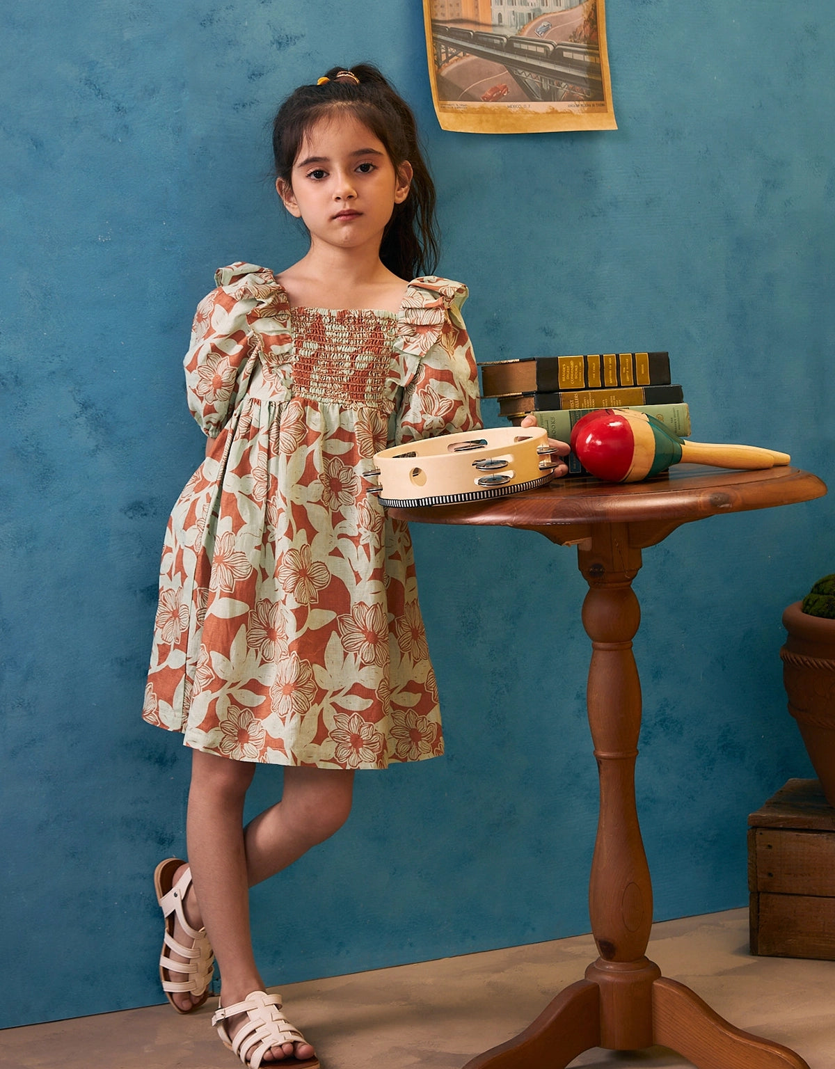 Girl wearing smocked bodice dress with ruffle and bubble sleeves—airy and feminine for warm-weather days at Gingersnaps Philippines.