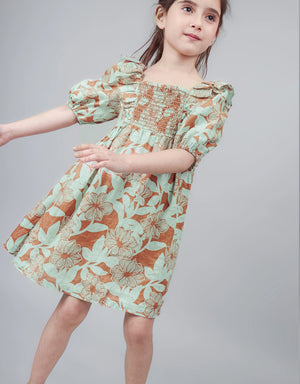 Close-up of smocking and ruffle detailing—crafted for comfort and seasonal charm.