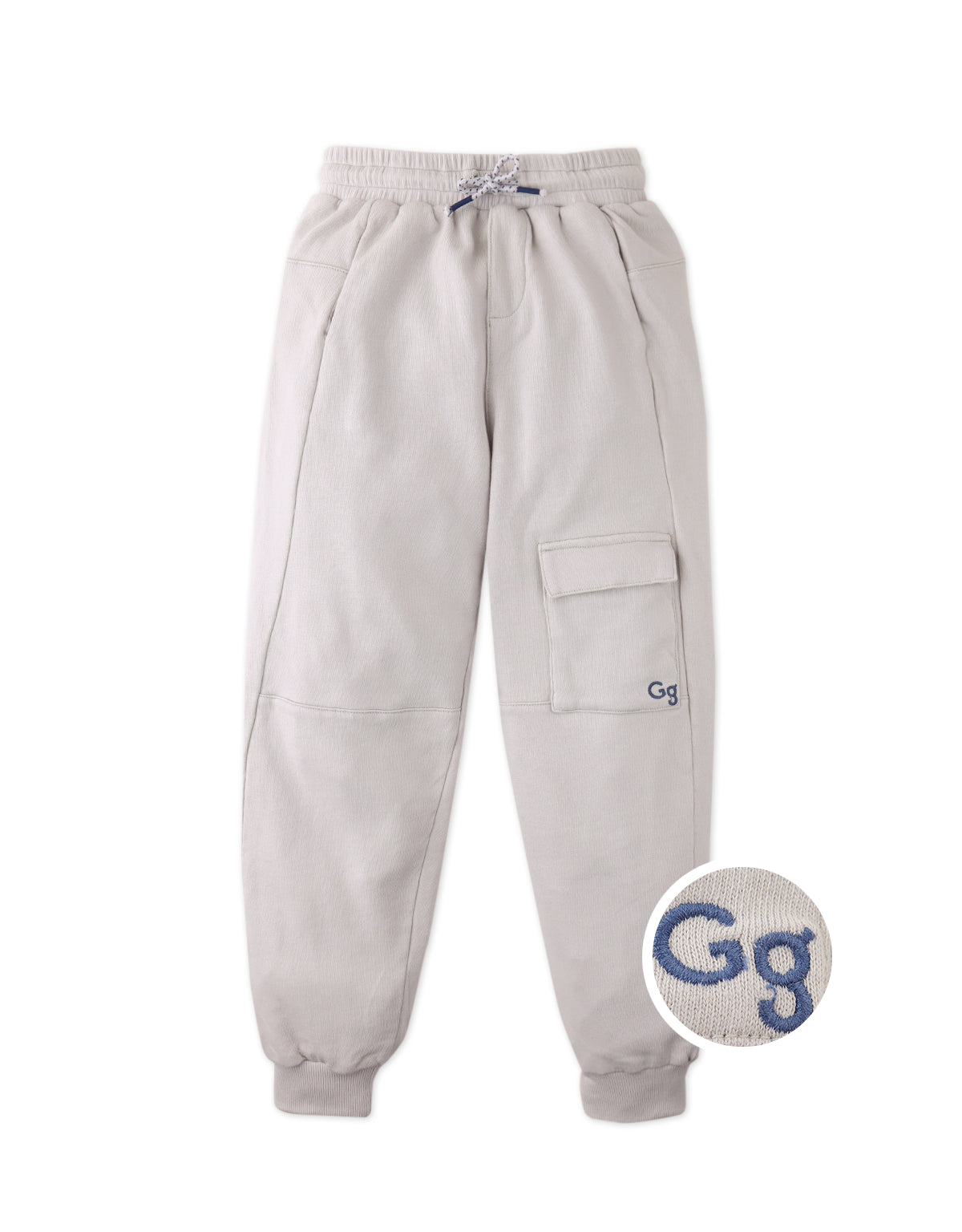 Close-up front detail of the Isaiah Sporty Cargo Joggers with Embroidered GG Logo in beige, highlighting the French terry fabric, cargo pockets, and embroidered logo from the streetwear-inspired collection of Gingersnaps Philippines.