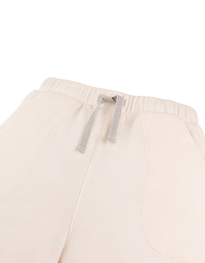 Detail front photo of Miles Pull-On Shorts in off-white, focusing on the elastic waistband and cotton fabric surface, from