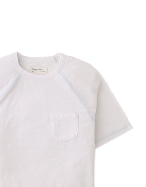 Details front photo of Kevin Jersey Raglan Tee in white showing soft cotton slub fabric and raglan sleeve seams, from the