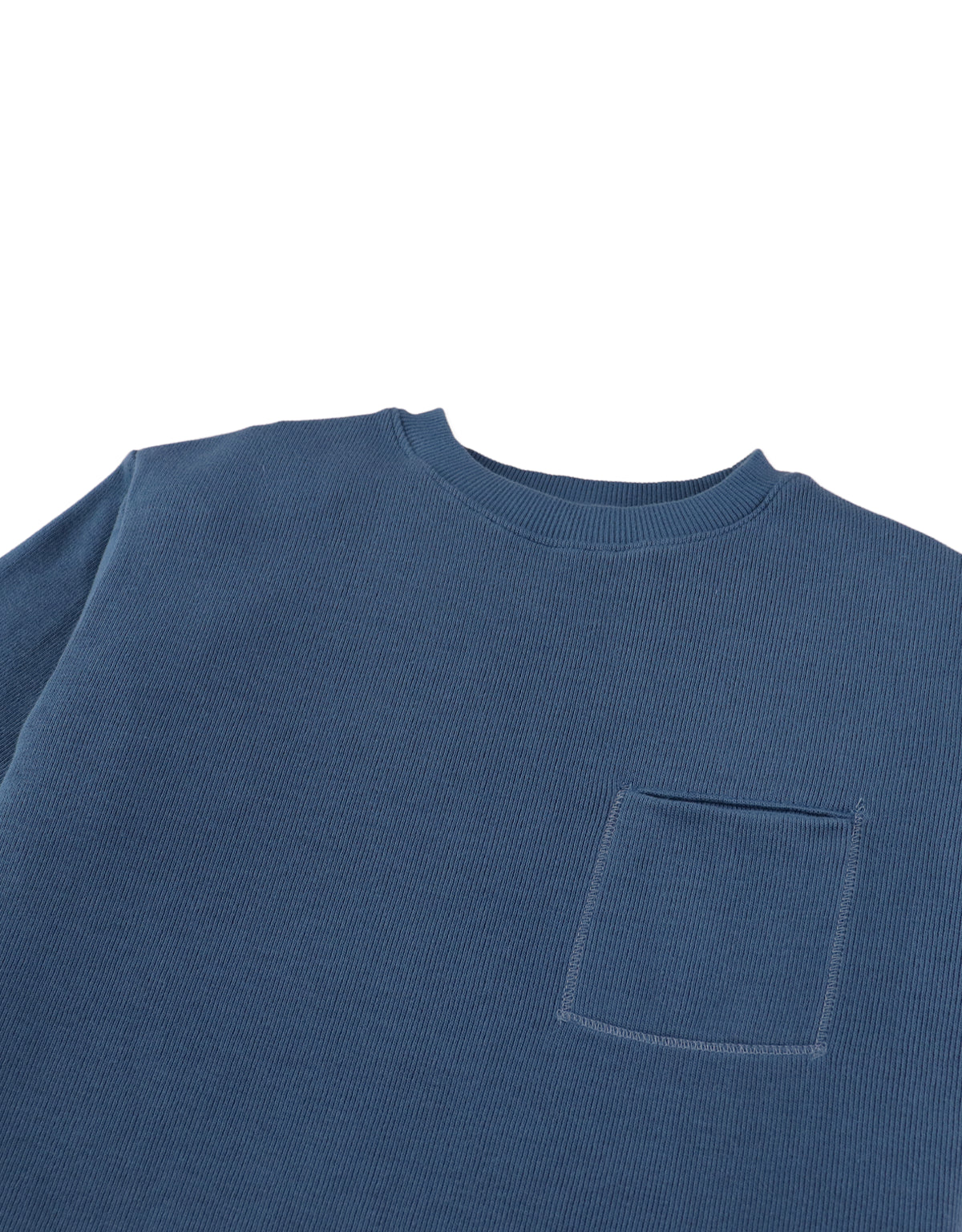 Detail front photo of Aris Tee in blue with front pocket, focusing on the chest pocket and cotton fabric surface, from the Holiday collection of Filipino kids fashion brand Gingersnaps Philippines.