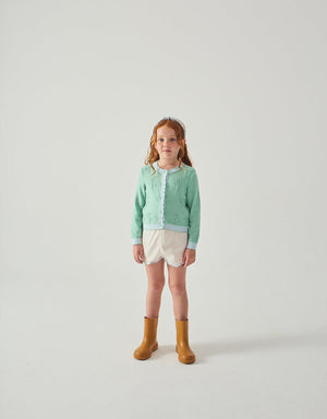 Flatlay front view of the Natalie Cardigan with Scalloped Ribbed Edges, showcasing knit texture and delicate trim details from the Spring Summer collection of Filipino kids fashion brand Gingersnaps Philippines.