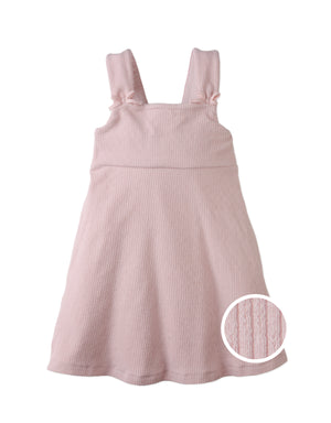 Campaign photo of the Colette Dress with Bow Ties on Straps from the Pastel Cherry Chic for Girls collection, featuring a