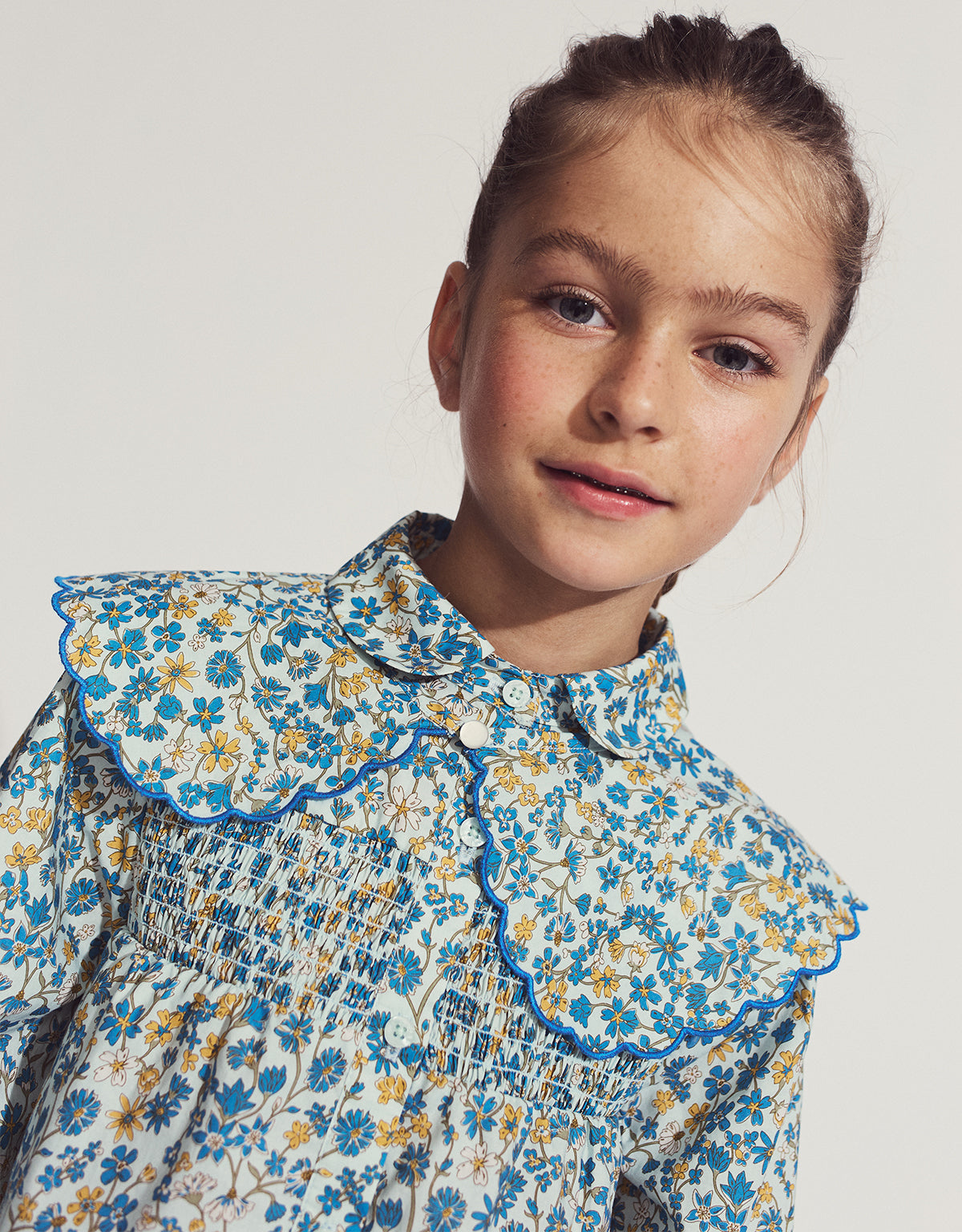 VINCENZA BLOUSE MONET WITH SMOCKING, PETER PAN COLLAR, AND DETACHABLE MINI CAPE