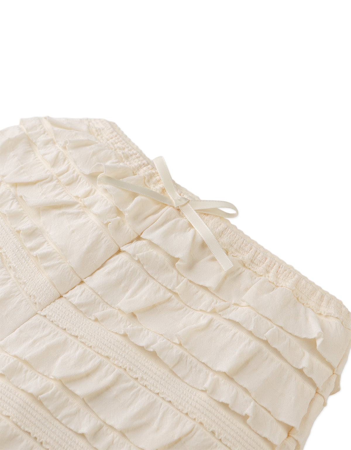 Flatlay front view of the Brielle Shorts showcasing their soft pastel tone and playful volume.