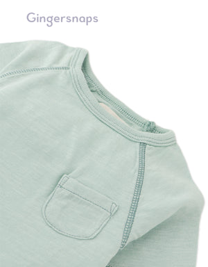 Details front photo of Baby Kevin Jersey Raglan Tee in green showing breathable cotton slub fabric and raglan sleeve seams for easy movement, from the Holiday collection of Filipino kids fashion brand Gingersnaps Philippines.