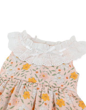 Close-up front detail of floral printed dress showing embroidered ruffle collar and sleeve stitching From Gingersnaps Floral Grace Collection