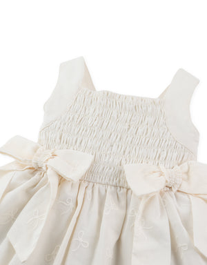 Close-up front detail of smocked dress with tiny bow embroidery and gathered bodice From Gingersnaps Floral Grace Collection