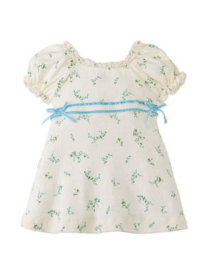 Details front photo of Baby Giselle Puff Sleeves Dress with satin ribbon trim on waist, showing floral print details, puff sleeve gathers, and satin ribbon accent, from the Holiday collection of Filipino kids fashion brand Gingersnaps Philippines.