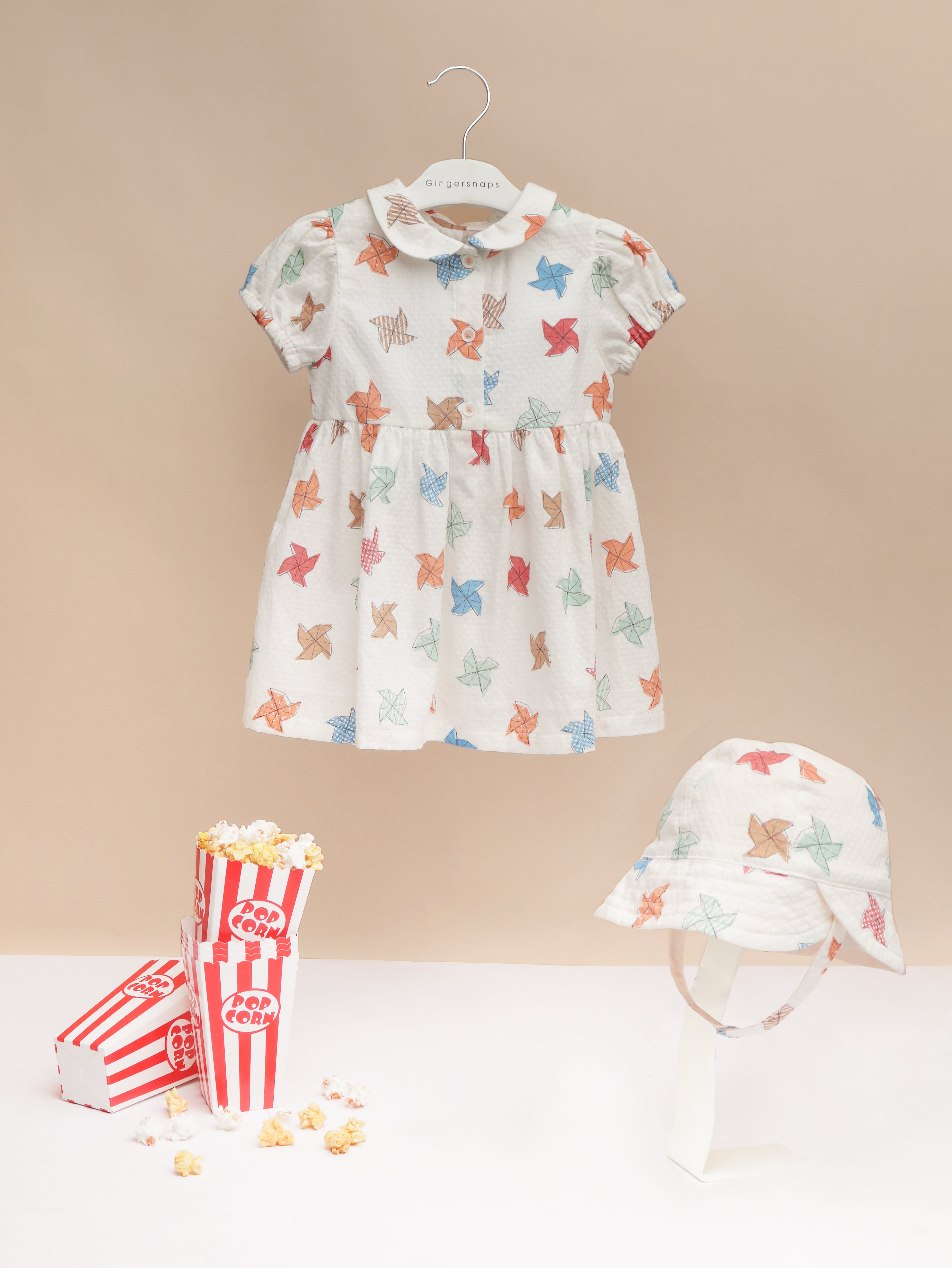 BABY DARCY DRESS IN PINWHEEL PRINT