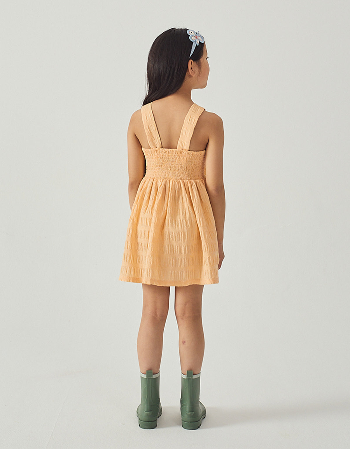 Emily Ruffled Apron Dress with Botanical Embroidery fabric and fit detail