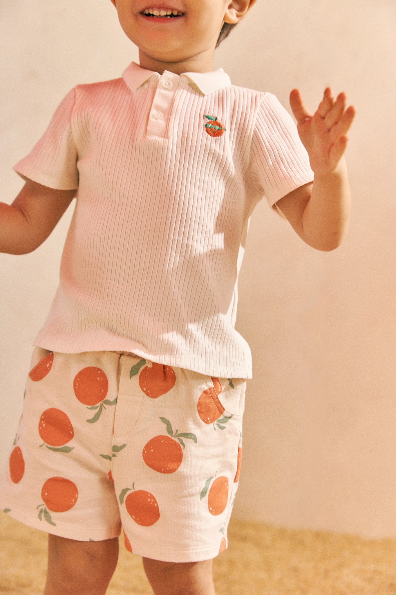 BABY BOYS PULL-ON SHORTS WITH ALL OVER ORANGE PRINT