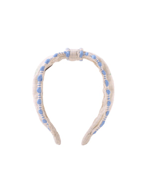 Delta Center Knot Headband With Embroidery fabric and fit detail