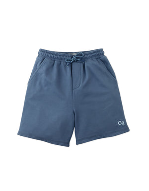 Full front catalog image of the Tim Drawstring Shorts in blue worn by young boy model, with embroidered GG logo for kids from the streetwear-inspired collection of Gingersnaps Philippines.