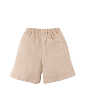Full back catalog image of the Scottie Shorts with Welt Pockets worn by young boy model for kids from the streetwear-inspired collection of Gingersnaps Philippines, highlighting their relaxed everyday silhouette.