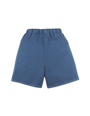 Full back photo of Eliot Shorts in blue with side pockets, showing the back panel and waistband structure, from the Holiday collection of Filipino kids fashion brand Gingersnaps Philippines.