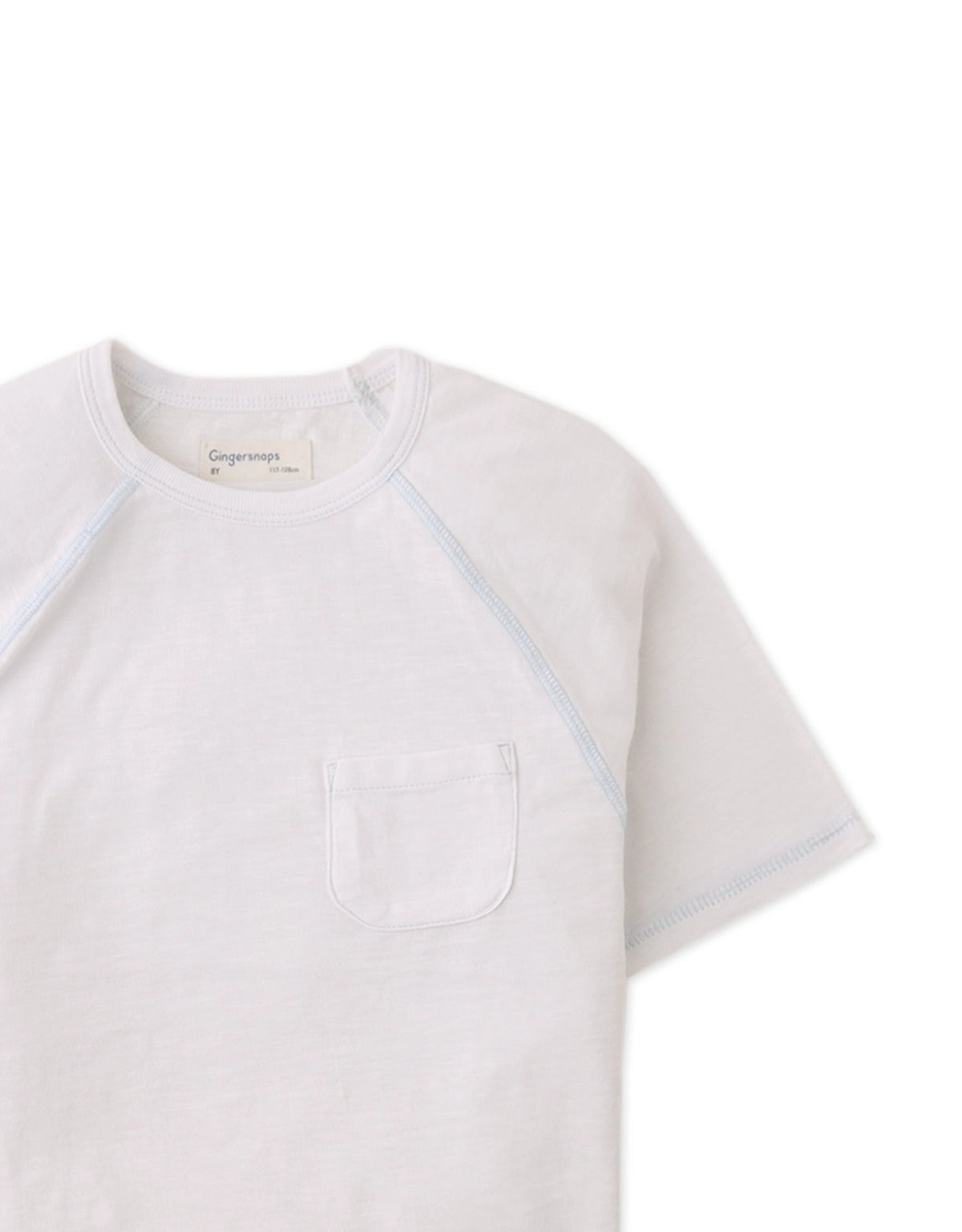Details front photo of Kevin Jersey Raglan Tee in white showing soft cotton slub fabric and raglan sleeve seams, from the Holiday collection of Filipino kids fashion brand Gingersnaps Philippines.