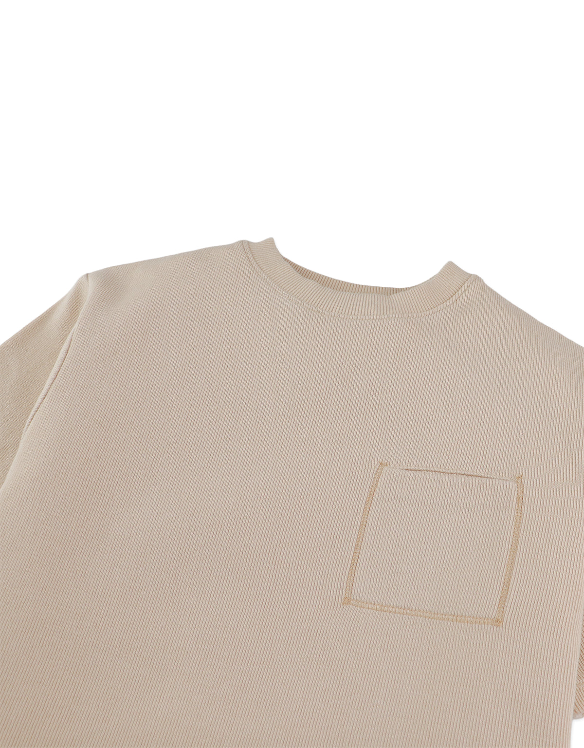 Detail front photo of Aris Tee in beige with front pocket, focusing on the chest pocket and cotton fabric surface, from the Holiday collection of Filipino kids fashion brand Gingersnaps Philippines.