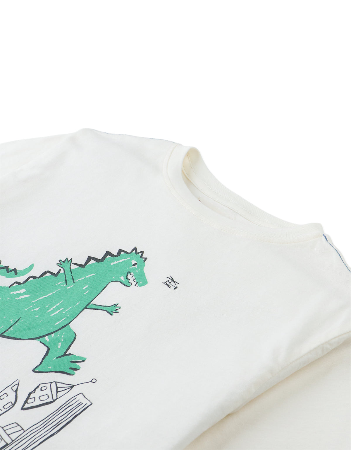 Details front photo of Rhett Graphic Tee with dinosaur print, showing playful dinosaur graphic and soft cotton texture, from the Holiday collection of Filipino kids fashion brand Gingersnaps Philippines.