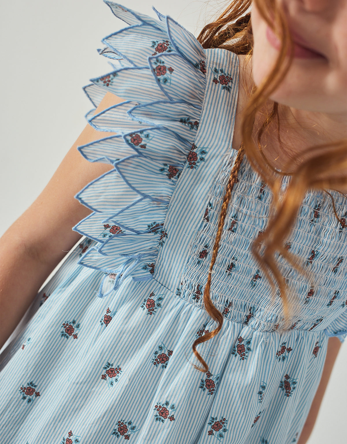 Close-up front detail of the Chloe Apron Dress with Smocked Bodice & Petal Sleeves, highlighting the textured smocking and soft petal sleeve finish from the Spring Summer collection of Gingersnaps Philippines.