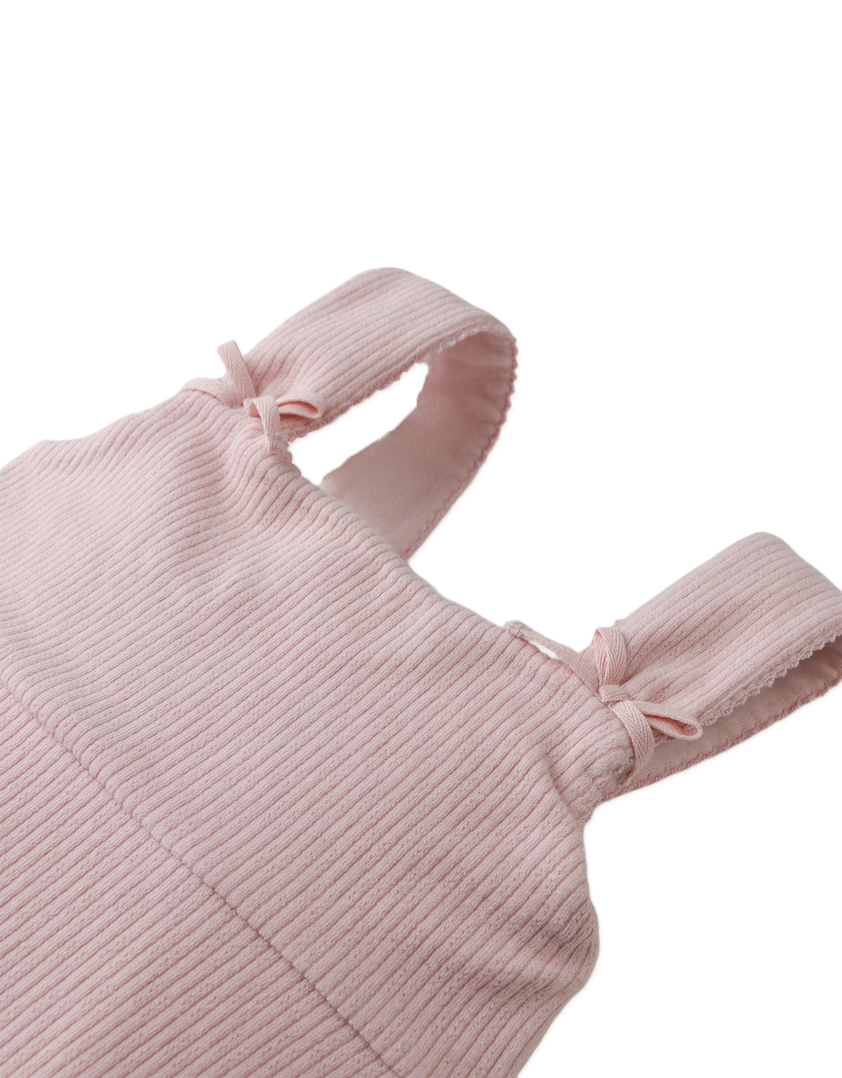 Flatlay front view of the Colette Dress showcasing its flowy cut, bow strap accents, and feminine pastel finish.