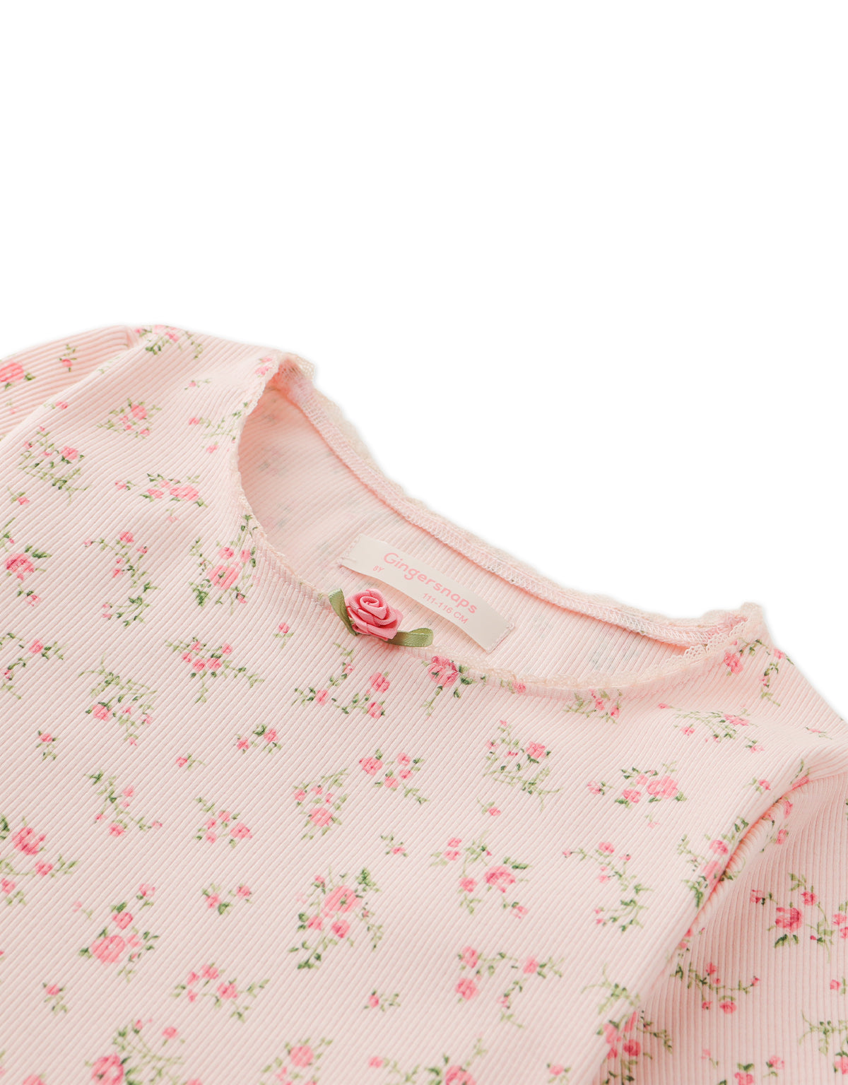 DARA ALL-OVER PRINT TOP WITH LACE AND ROSETTE DETAILS