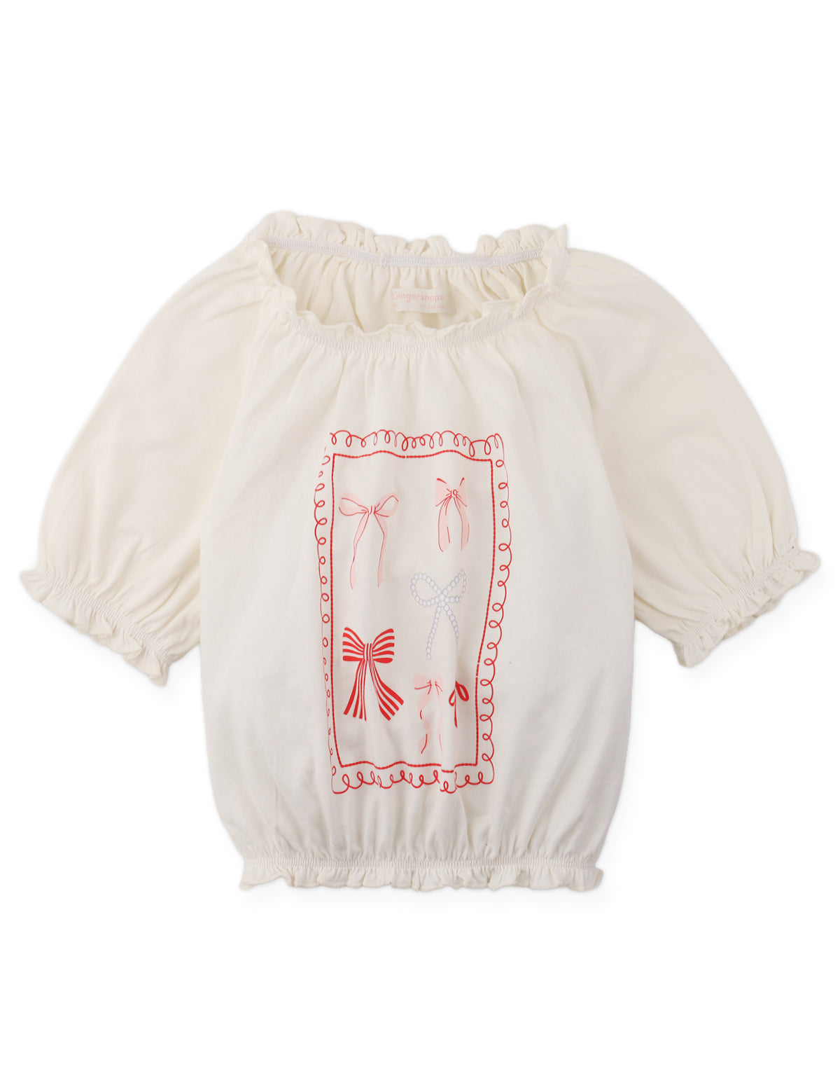 Details front photo of Maru T-Shirt with puff sleeves bow spot print, showing playful bow spot pattern and gently gathered puff sleeves, from the Holiday collection of Filipino kids fashion brand Gingersnaps Philippines.