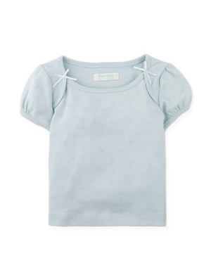 Details front photo of Suzie Cropped Top with bow applique in pastel blue, showing soft fabric texture and delicate bow applique details, from the Holiday collection of Filipino kids fashion brand Gingersnaps Philippines.