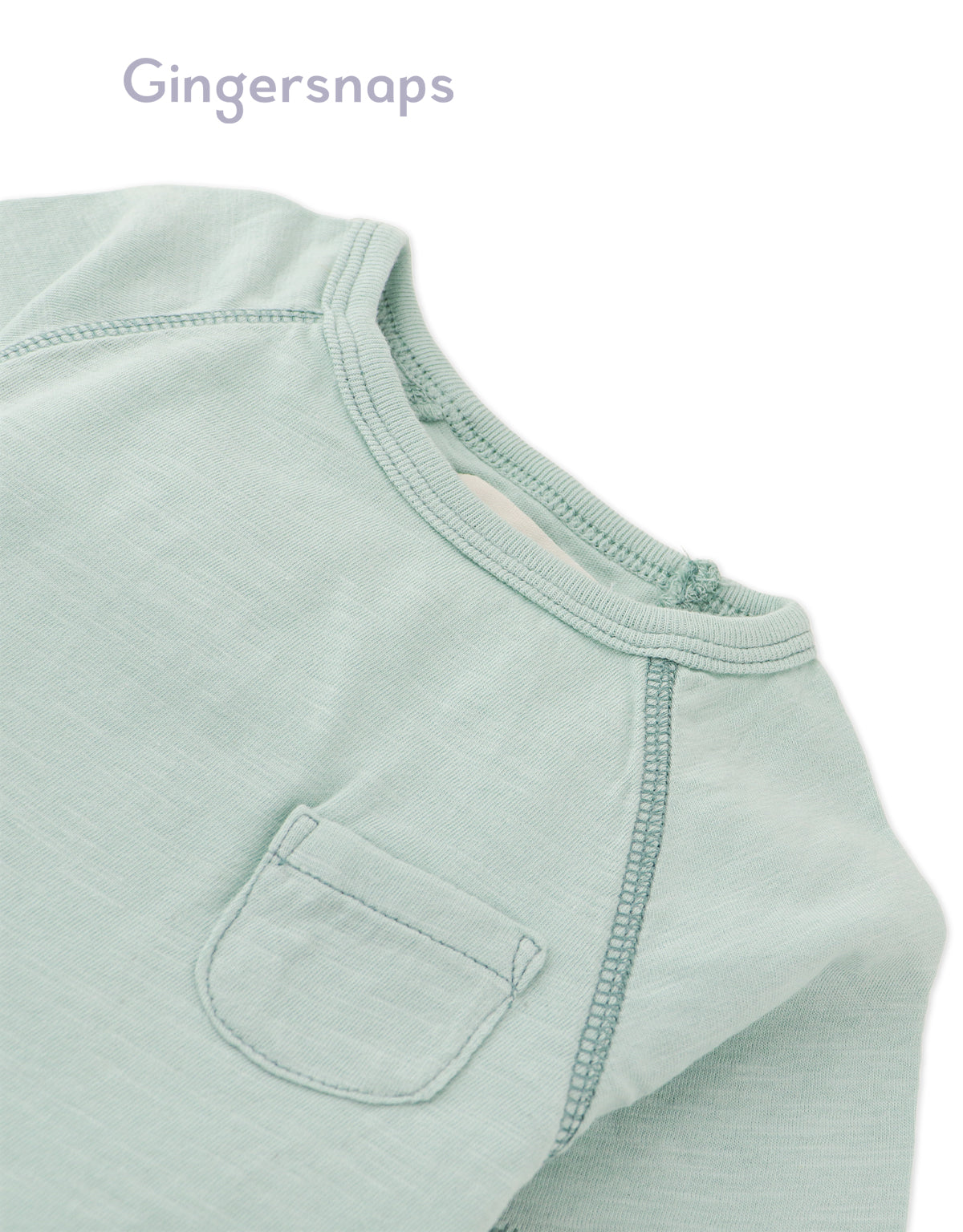 Details front photo of Baby Kevin Jersey Raglan Tee in green showing breathable cotton slub fabric and raglan sleeve seams for easy movement, from the Holiday collection of Filipino kids fashion brand Gingersnaps Philippines.