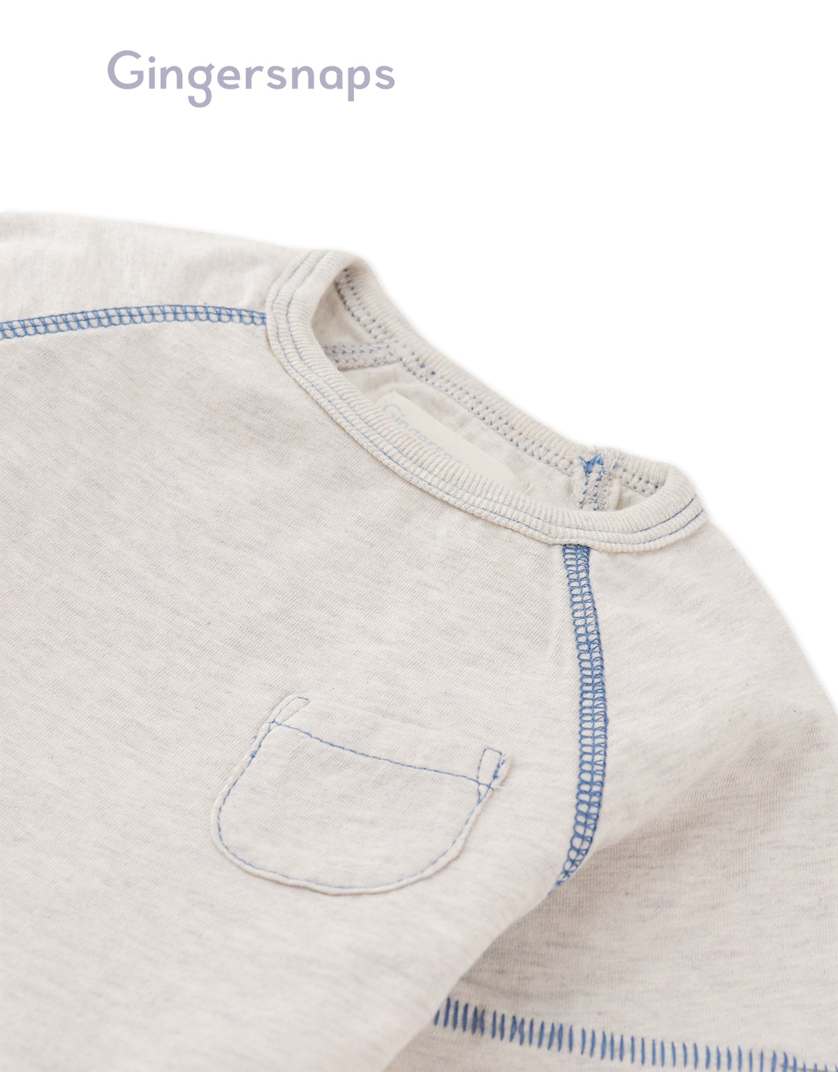 Details front photo of Baby Kevin Jersey Raglan Tee in gray showing breathable cotton slub fabric and raglan sleeve seams for easy movement, from the Holiday collection of Filipino kids fashion brand Gingersnaps Philippines.