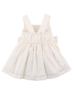 Full back view of smocked dress with tiny bow embroidery and large self-fabric bow at the back From Gingersnaps Floral Grace Collection