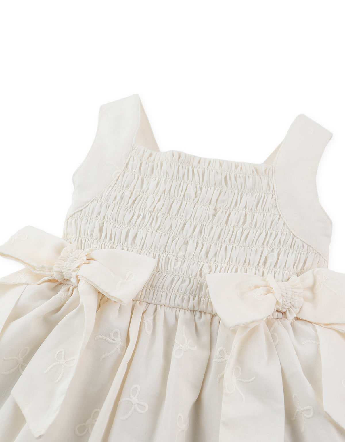 Close-up front detail of smocked dress with tiny bow embroidery and gathered bodice From Gingersnaps Floral Grace Collection