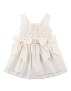 Full front view of smocked dress with tiny bow embroidery and oversized self-fabric bow accent From Gingersnaps Floral Grace Collection