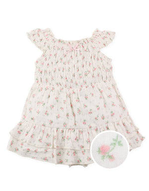 Full front view of floral printed smocked playsuit featuring inner shorts and ribbon tie accents From Gingersnaps Floral Grace Collection