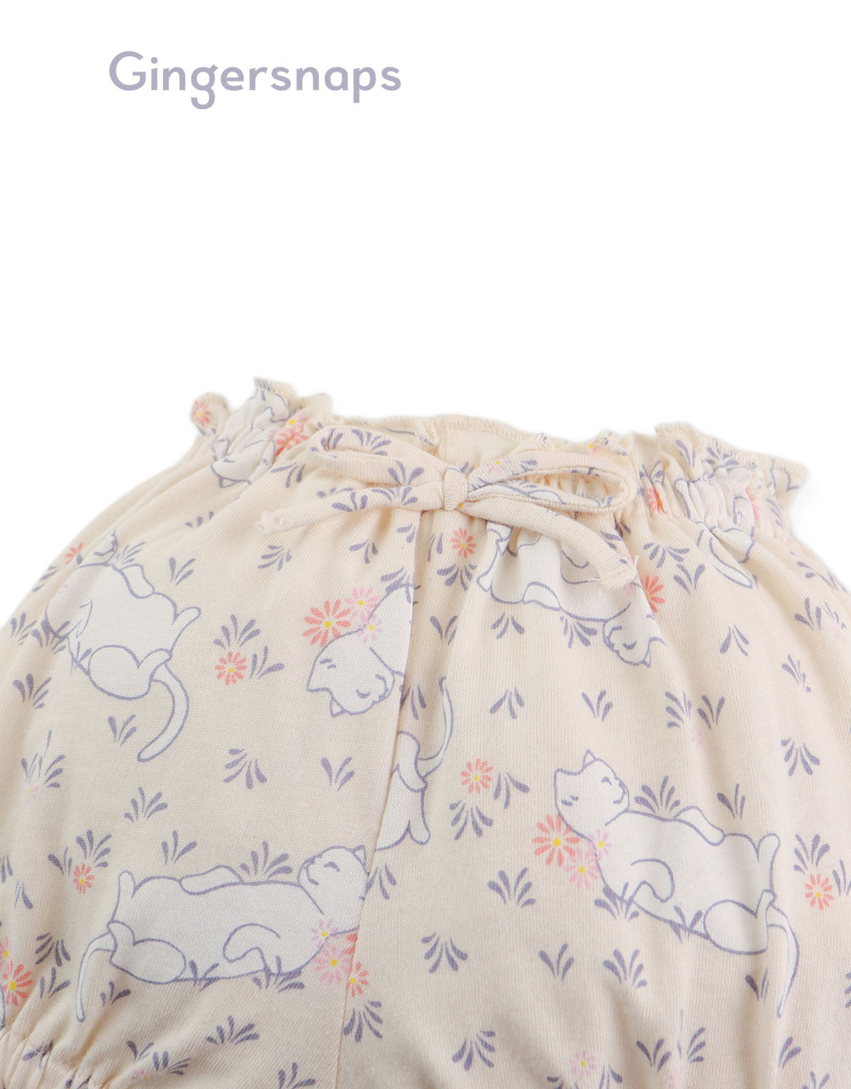 Details front photo of Baby Lyra Bloomers in printed design showing bow applique and ruffle hem detail from the Holiday collection of Filipino kids fashion brand Gingersnaps Philippines.