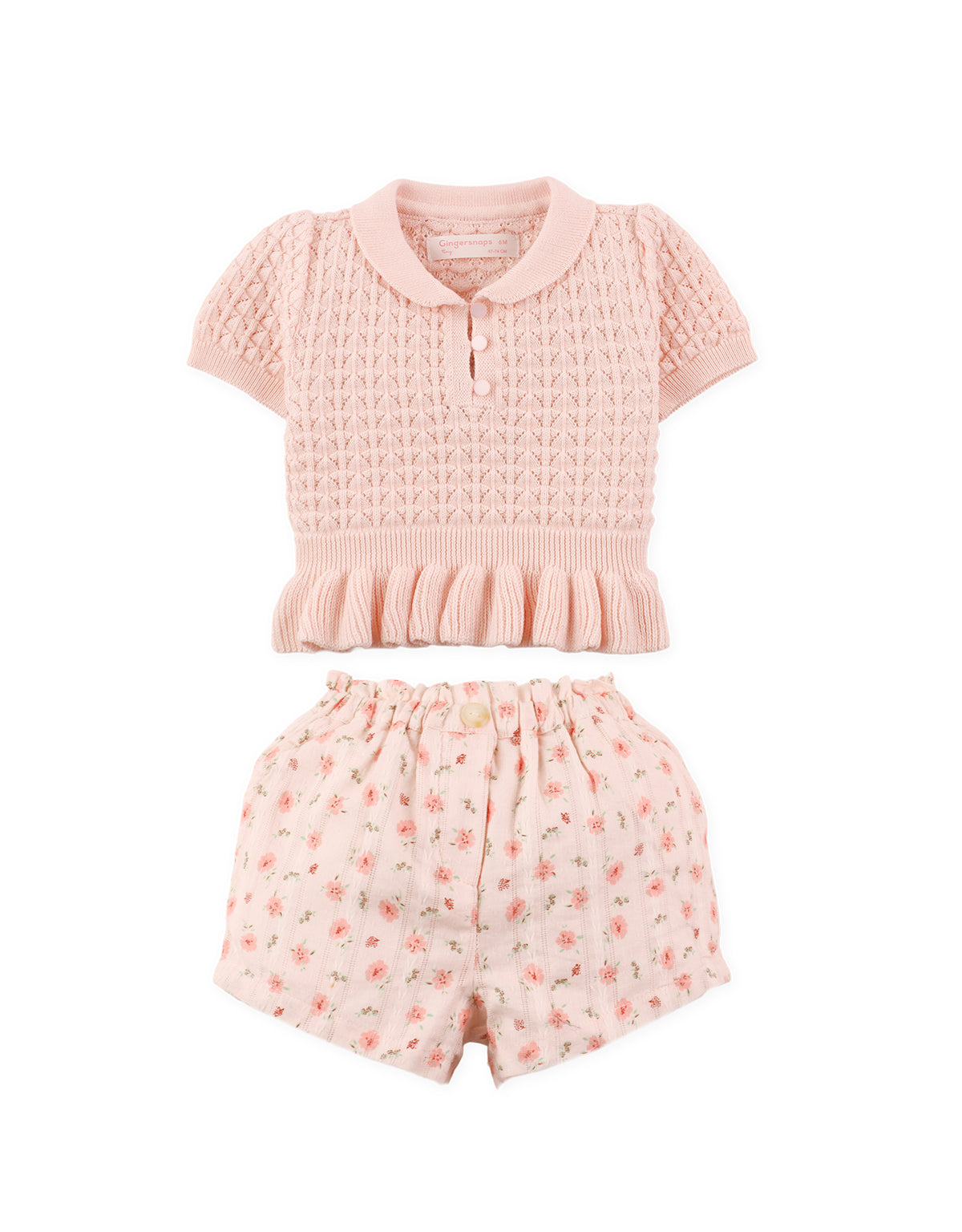 Full front view of pointelle knit peplum top styled with printed shorts set From Gingersnaps Floral Grace Collection