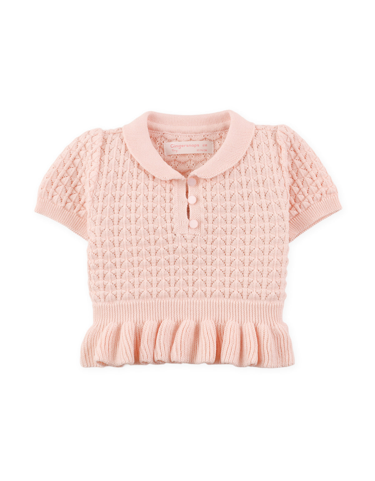 Close-up back detail of pointelle knit peplum top with textured stitching From Gingersnaps Floral Grace Collection