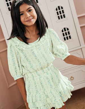 Campaign image of girl wearing blue floral print tiered skirt with elastic waist From Gingersnaps PH